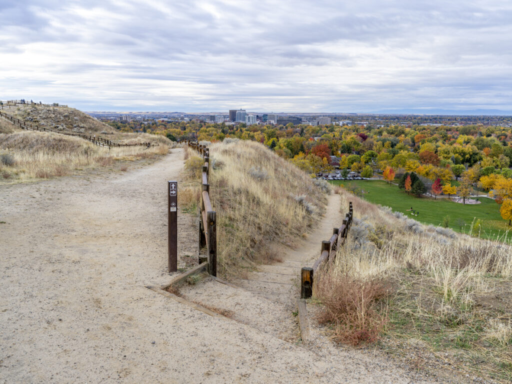 Boise Idaho trail system over a city covered with autumn trees