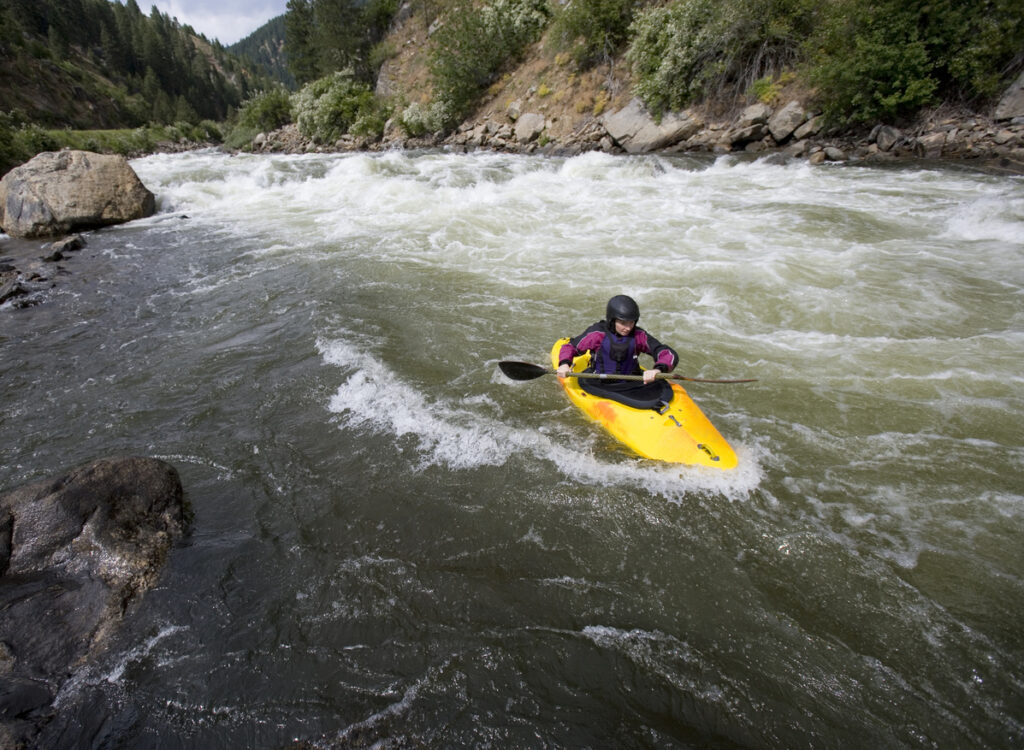 "Woman Kayaking , Payette River  , Idaho"